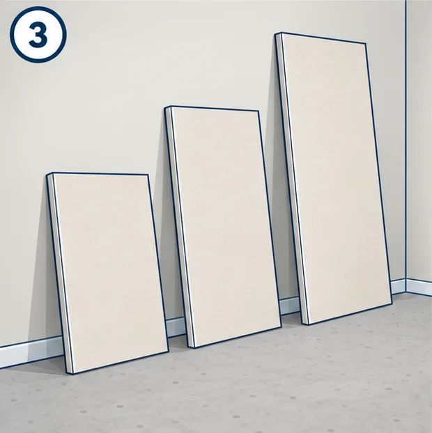 Drywall sheets of different lengths leaning against a wall